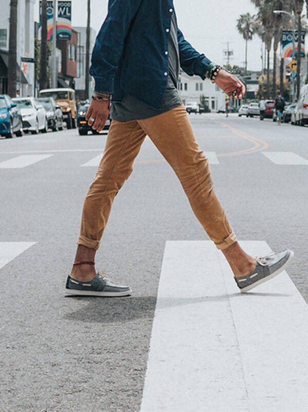 Person walking across marked crosswalk.